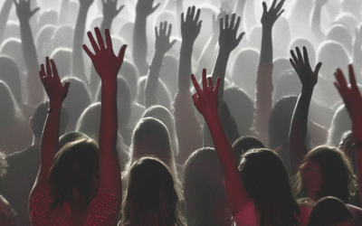 Evangelicals in church raising their hands high for Christian nationalism